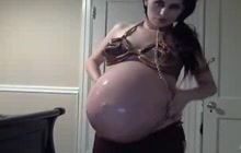 Pregnant Arab lady teasing with her belly